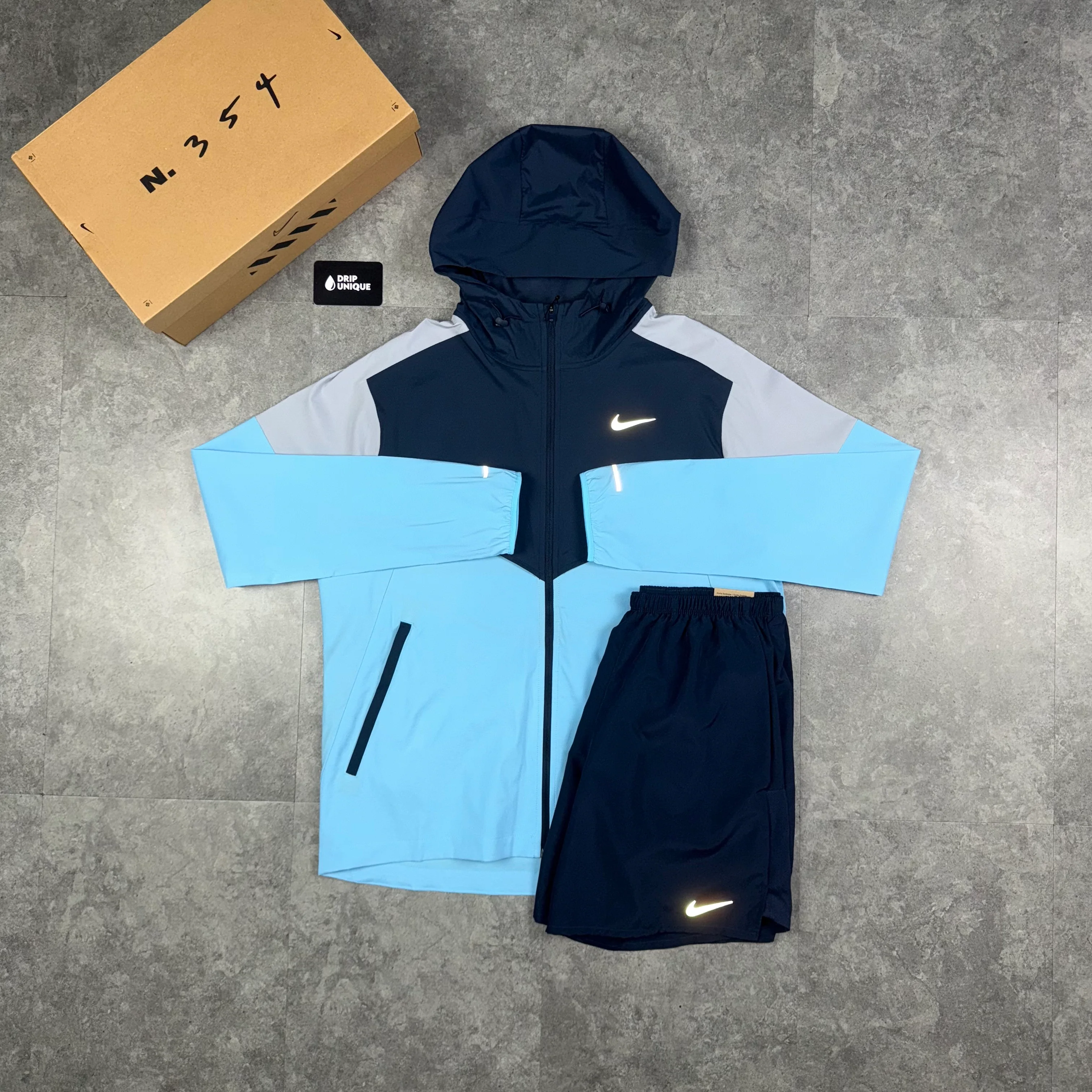 NK UV Windrunner Jacket Aquarius Blue & Navy Blue Challenger Shorts Set