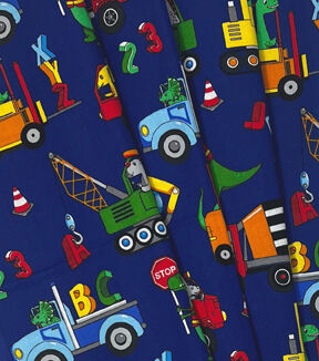 Dinosaurs & Trucks on Blue Novelty Cotton Fabric