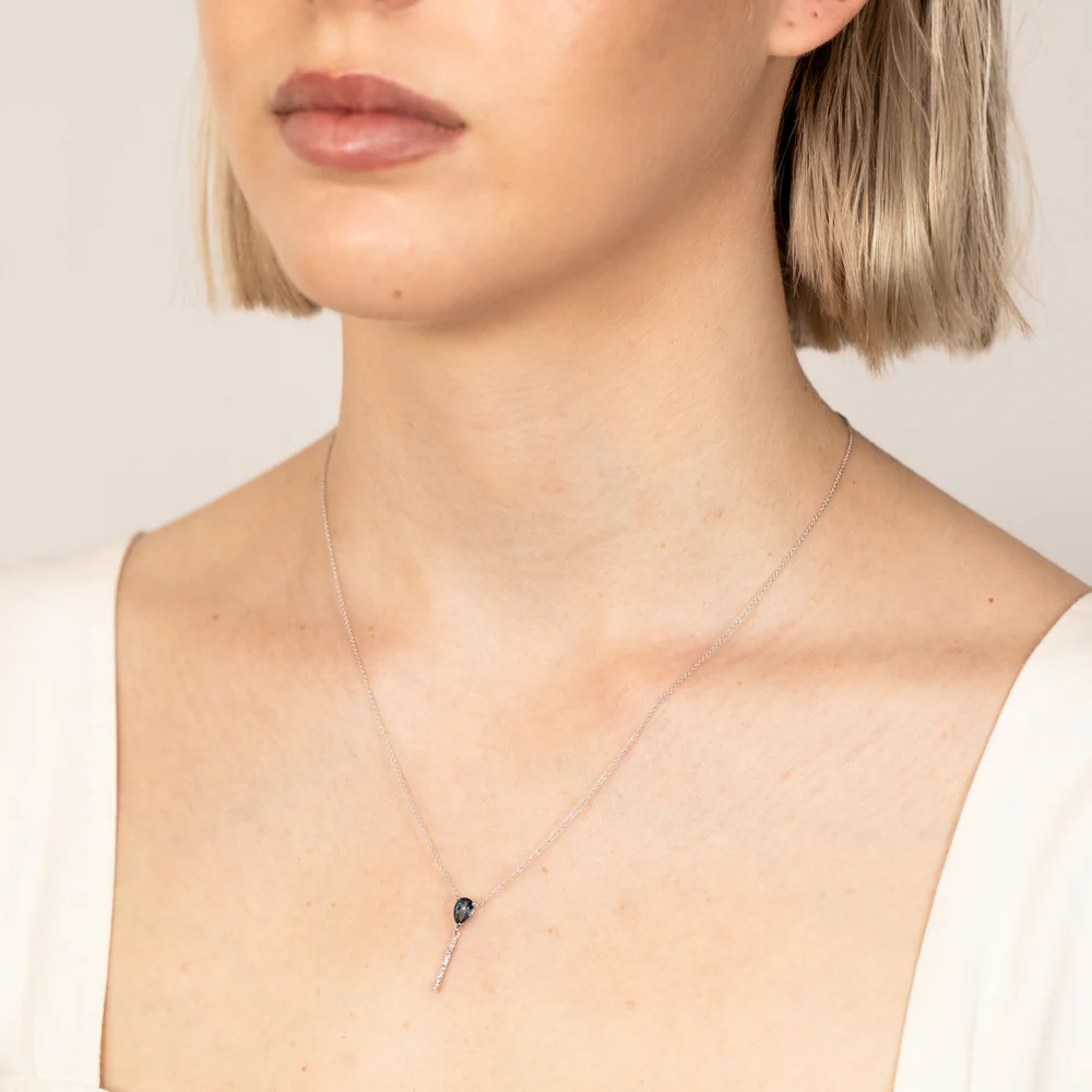 9ct White Gold 0.48Ct Blue Topaz in 10 Diamonds