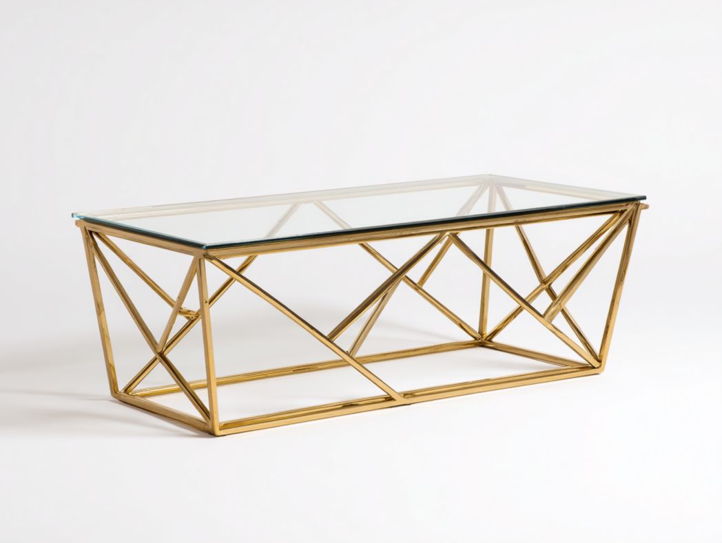 Table basse rectangulaire avec plateau en verre et structure métallique dorée géométrique