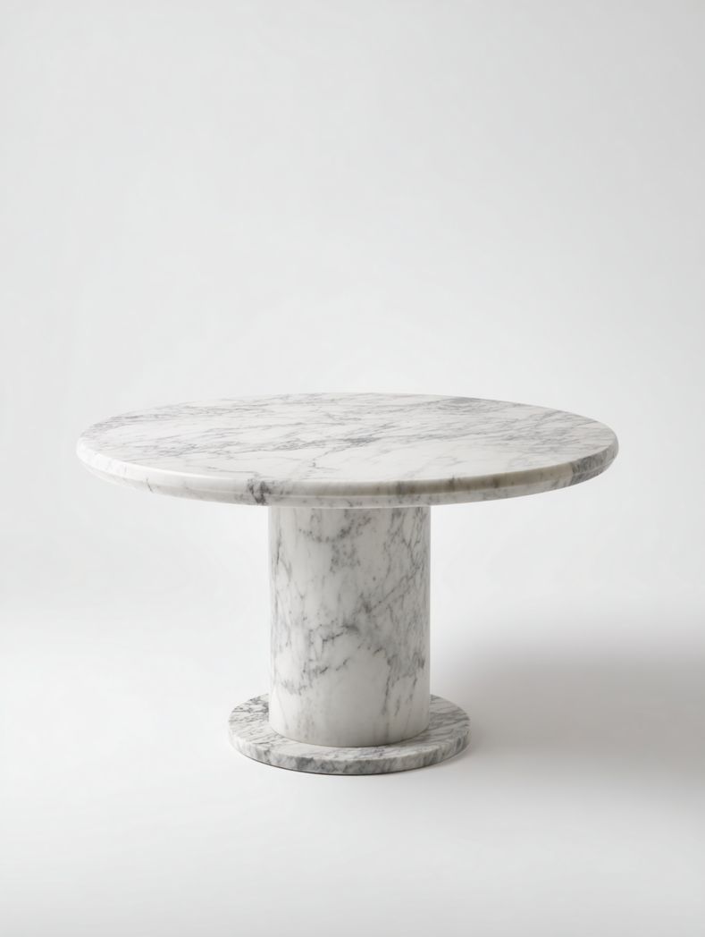 Table ronde en marbre blanc avec piètement cylindrique, style moderne épuré