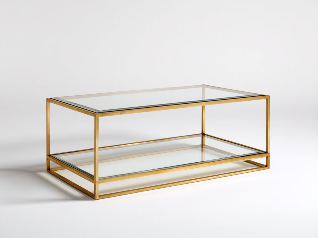 Table basse rectangulaire à deux niveaux avec plateau en verre transparent et cadre métallique doré