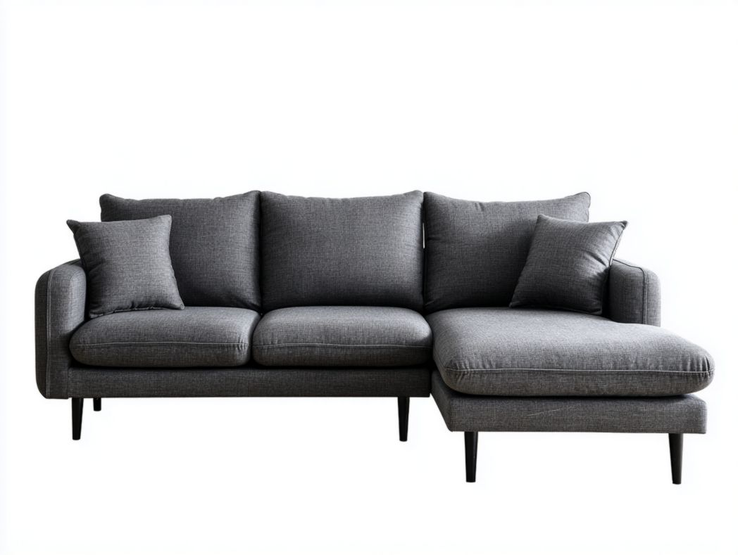 Canapé d'angle gris foncé avec méridienne, coussins et pieds noirs fins