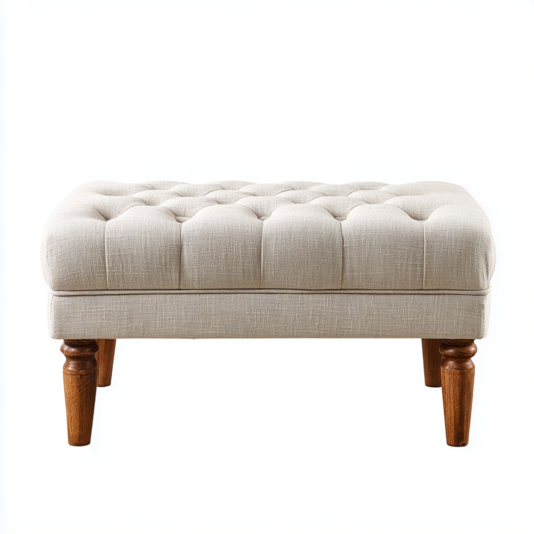 Banc rectangulaire avec assise capitonnée en tissu beige et pieds en bois sculptés