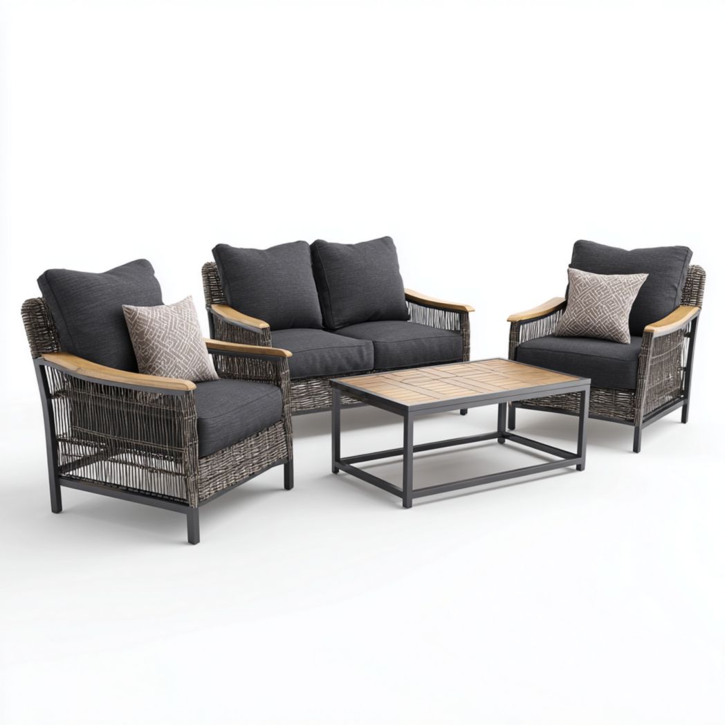 Salon bas de jardin, structure en rotin avec coussins noirs, canapé deux places, deux fauteuils et une table rectangulaire