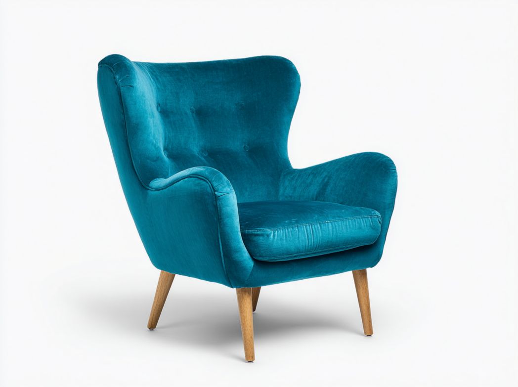 Fauteuil en velours bleu-vert avec pieds en bois