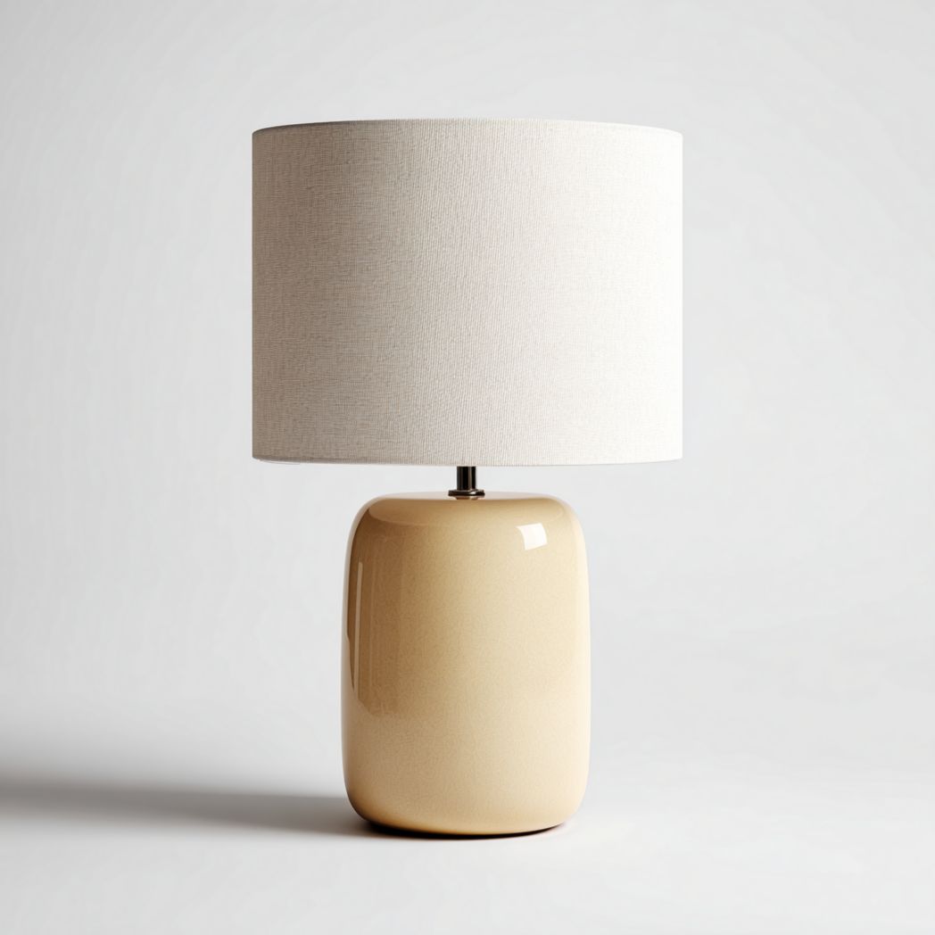 Lampe de table en céramique beige clair avec abat-jour cylindrique en tissu blanc