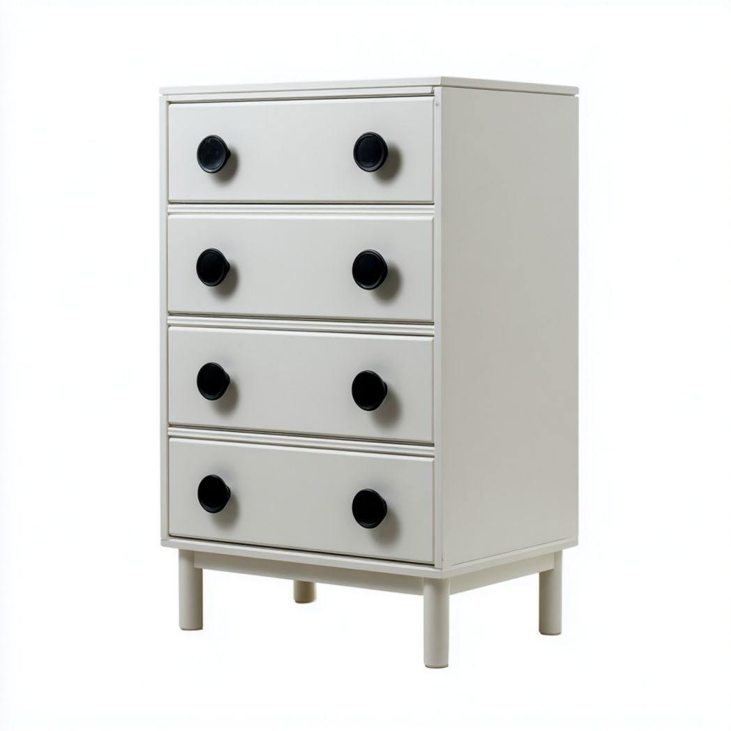 Commode à quatre tiroirs avec structure blanche et poignées rondes noires sur pieds cylindriques