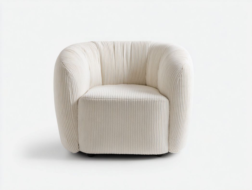 Fauteuil en velours côtelé beige clair à structure arrondie monobloc