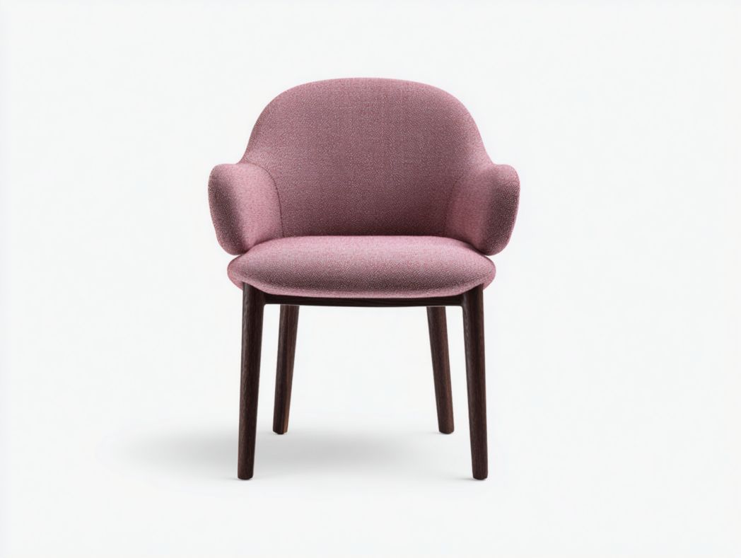 Fauteuil en tissu rose avec dossier arrondi et pieds en bois foncé