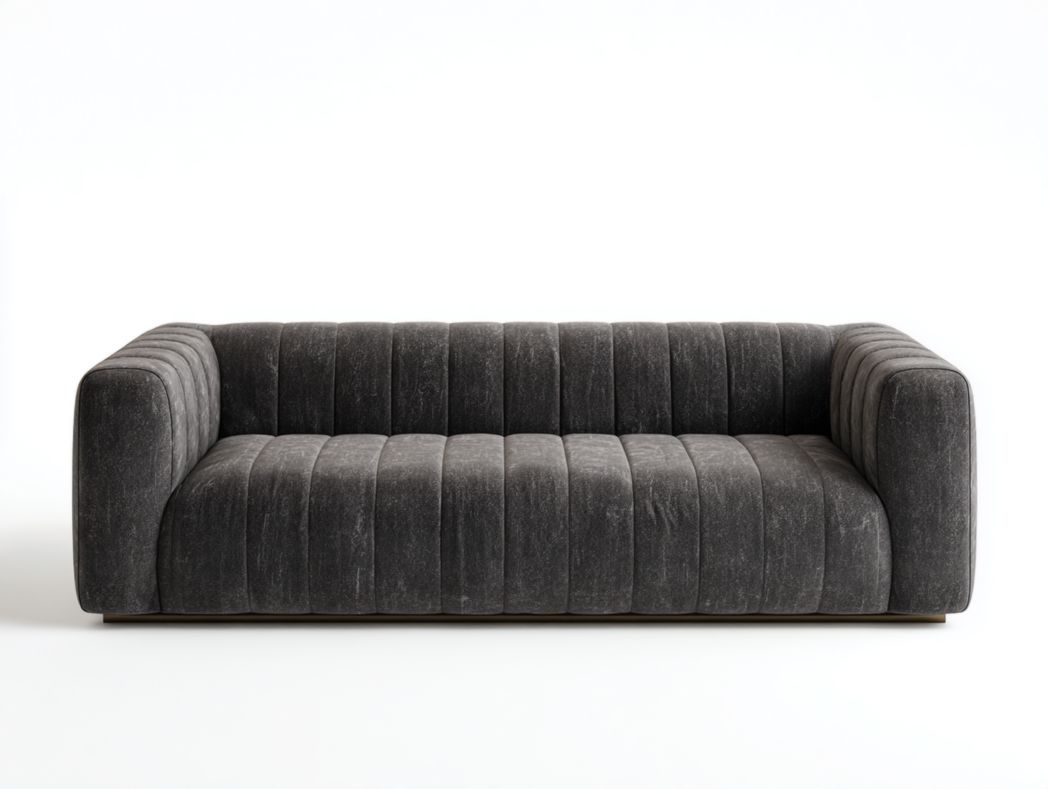 Canapé en tissu velours gris foncé, structure basse et dossier à coutures verticales