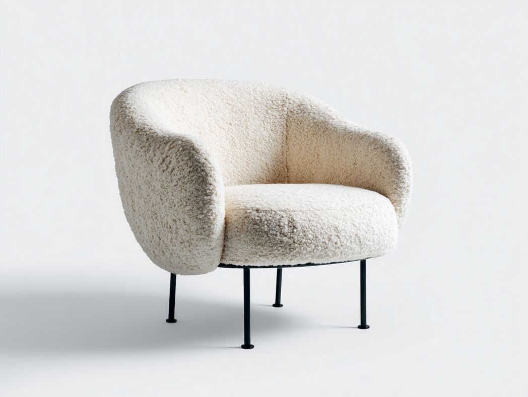 Fauteuil en tissu bouclette beige clair à forme arrondie avec pieds métalliques noirs