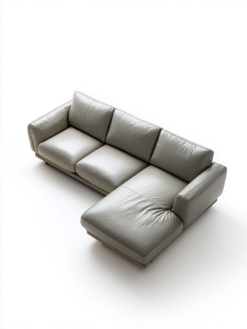 Canapé d'angle en cuir gris clair avec coussins en mousse haute densité