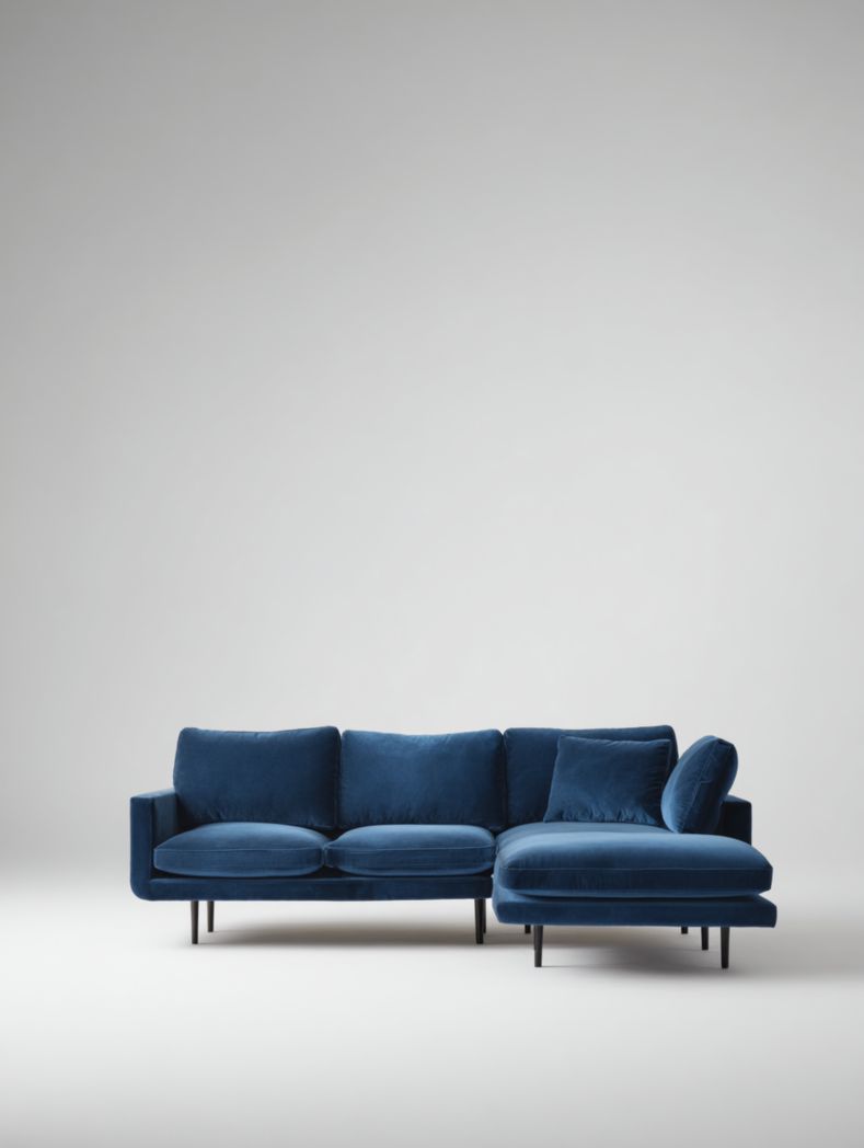 Canapé d'angle en tissu bleu foncé avec deux coussins et pieds en métal noir