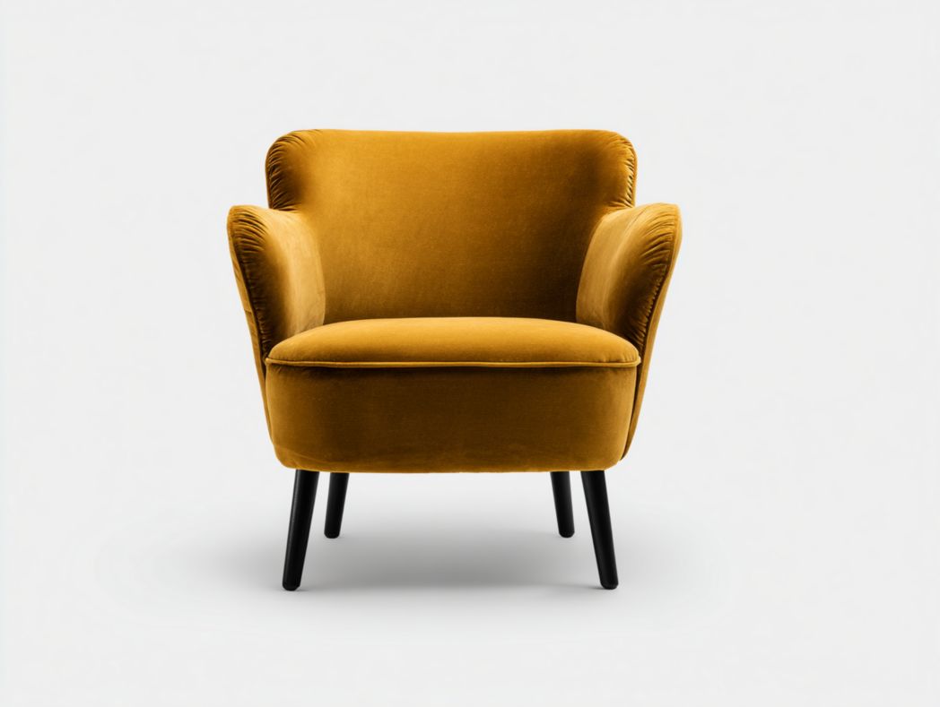 Fauteuil en velours jaune avec dossier arrondi et pieds en métal noir