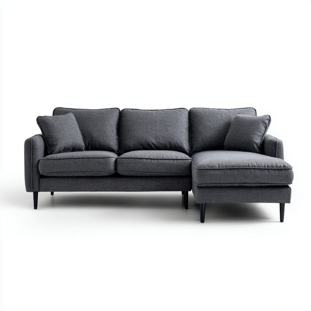 Canapé d'angle en tissu gris foncé, forme en L, pieds en bois noir, avec coussins