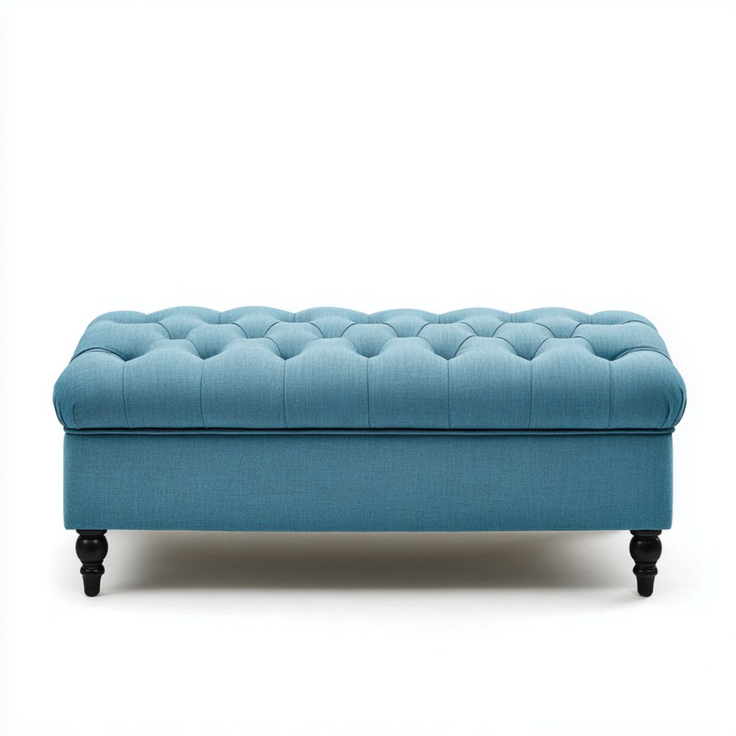 Banquette de rangement capitonnée en tissu bleu avec pieds ronds noirs