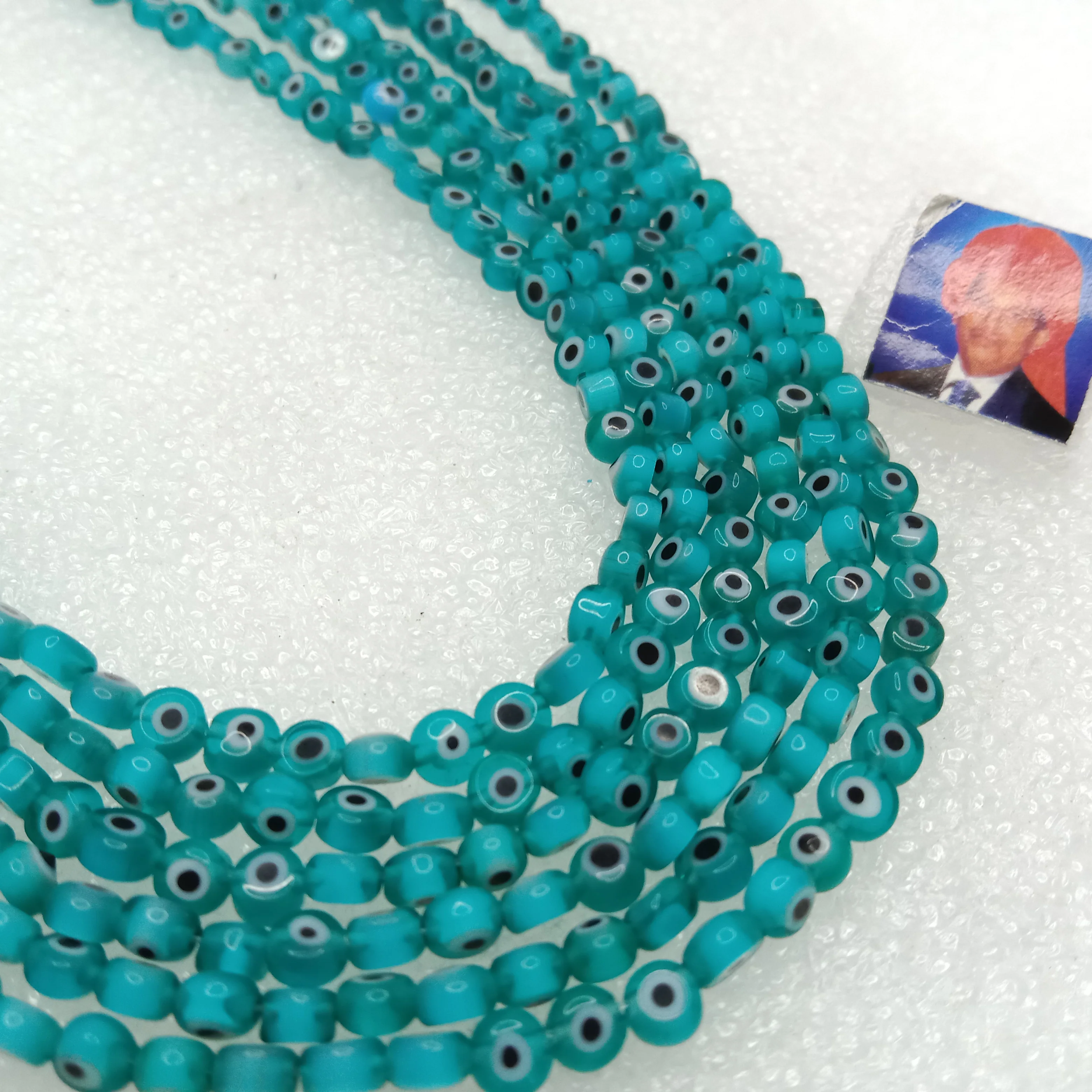 Sea green Evil eye flat  shape beads 4mm 1 string