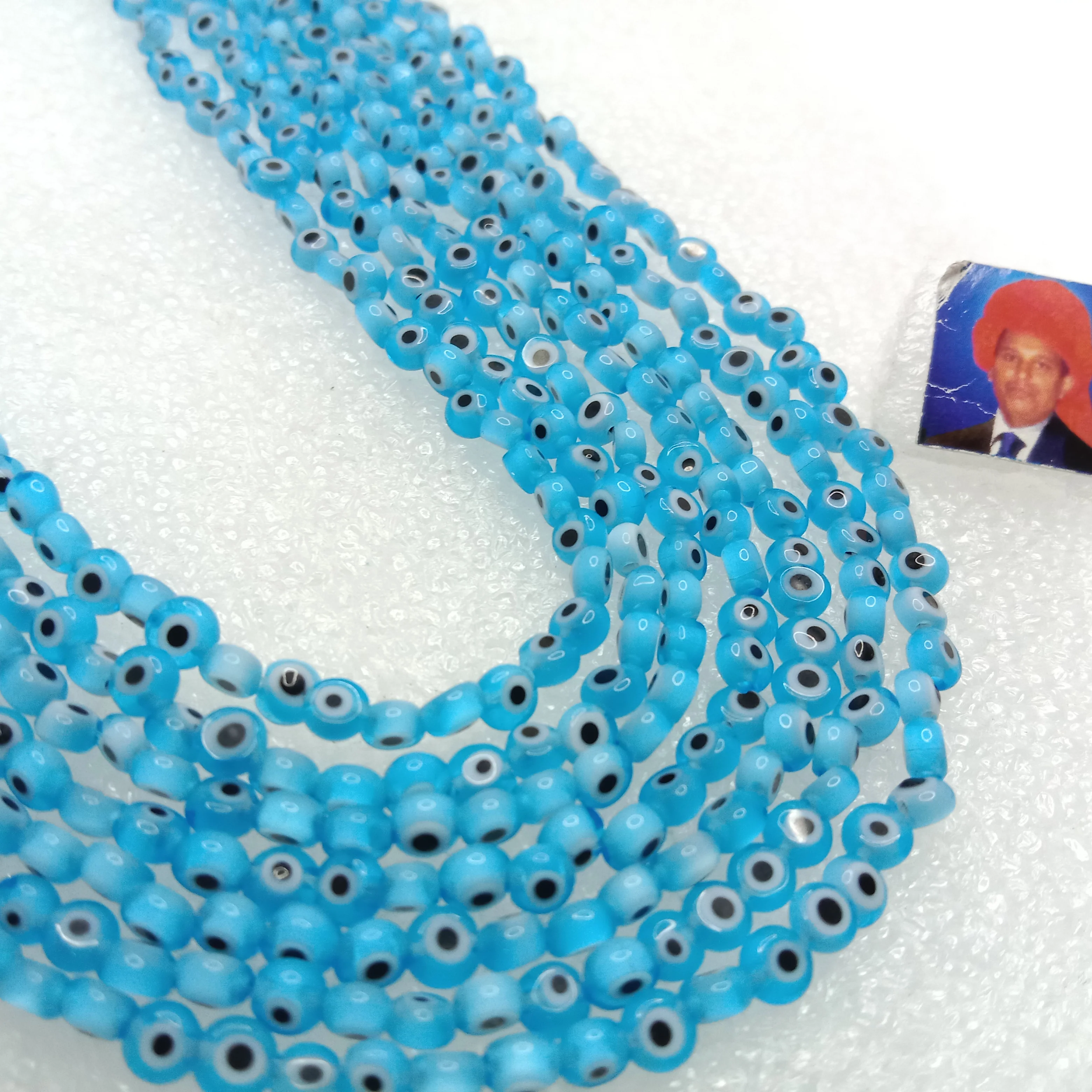 Light blue  Evil eye flat shape beads 4mm 1 string