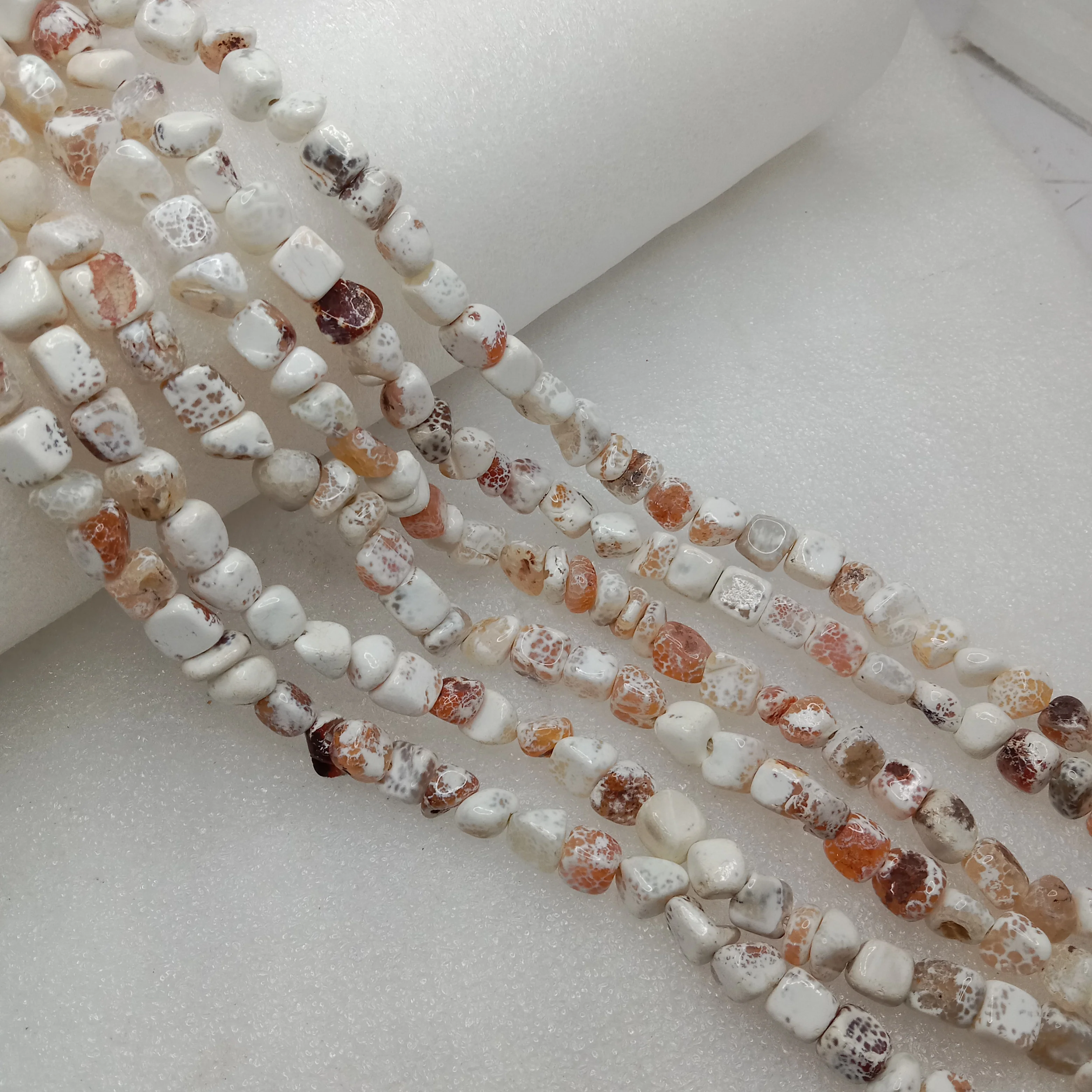 Textured white with brown shaded beads