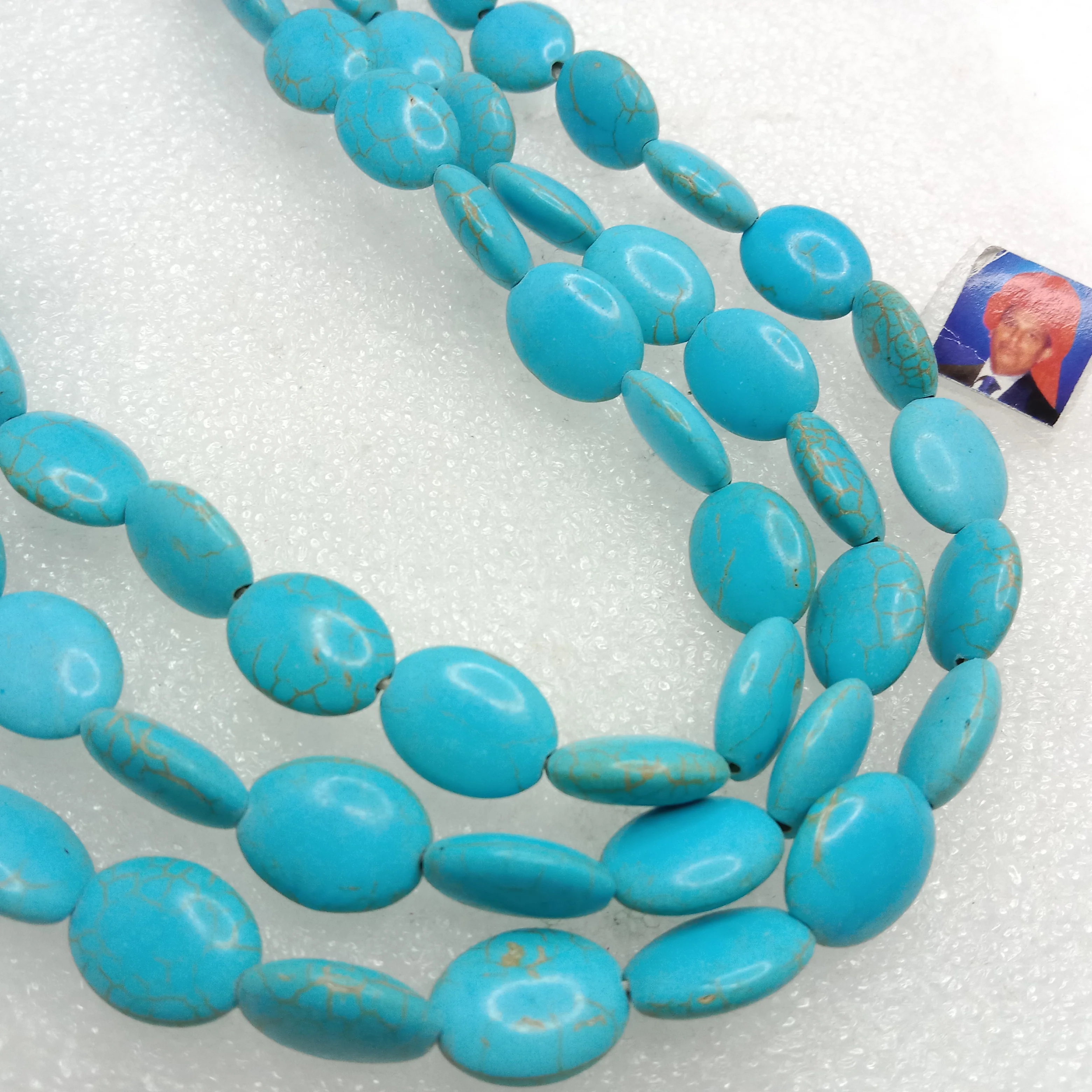 Small flat oval shape turquoise beads 1 string