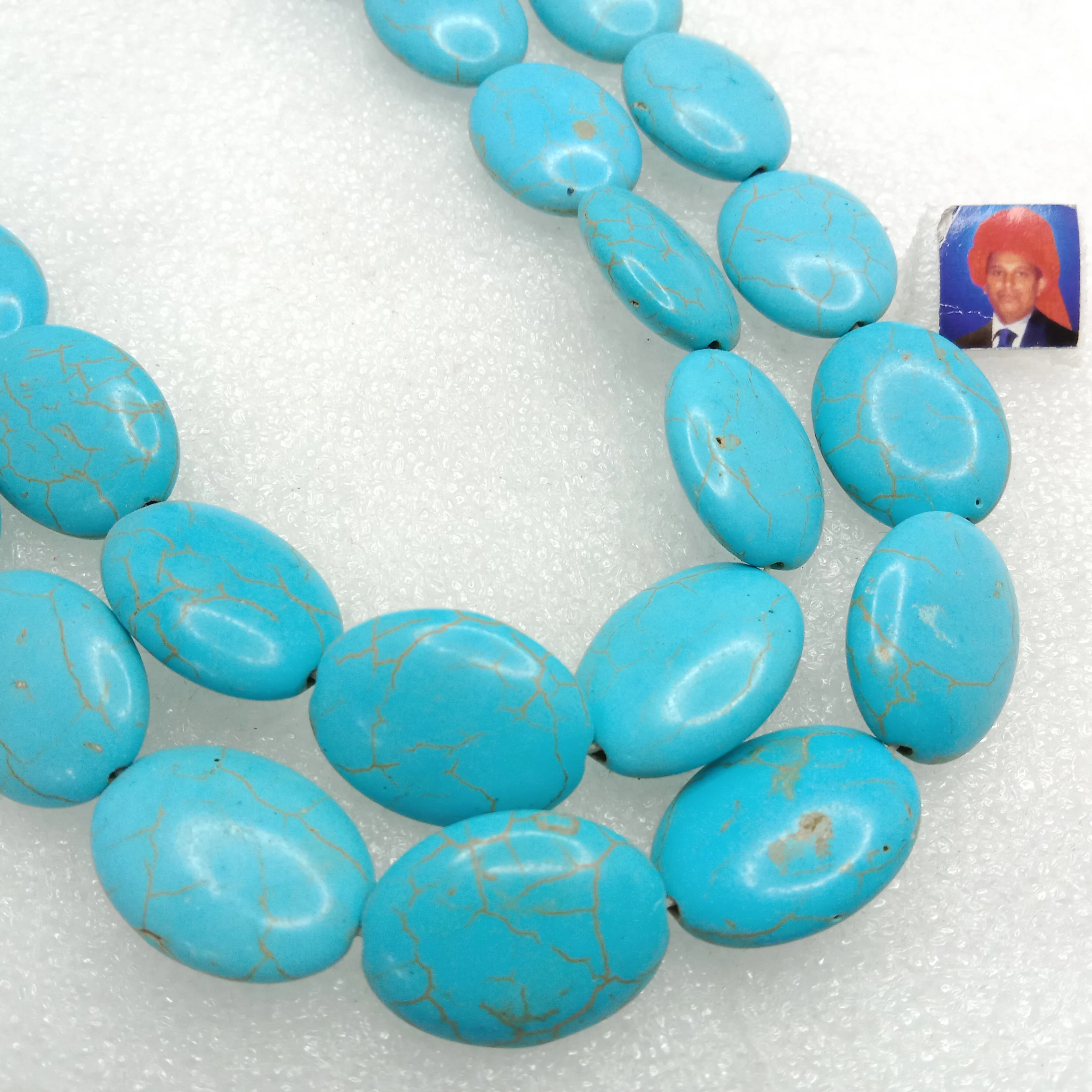 Flat puffed oval shape turquoise beads 1 string