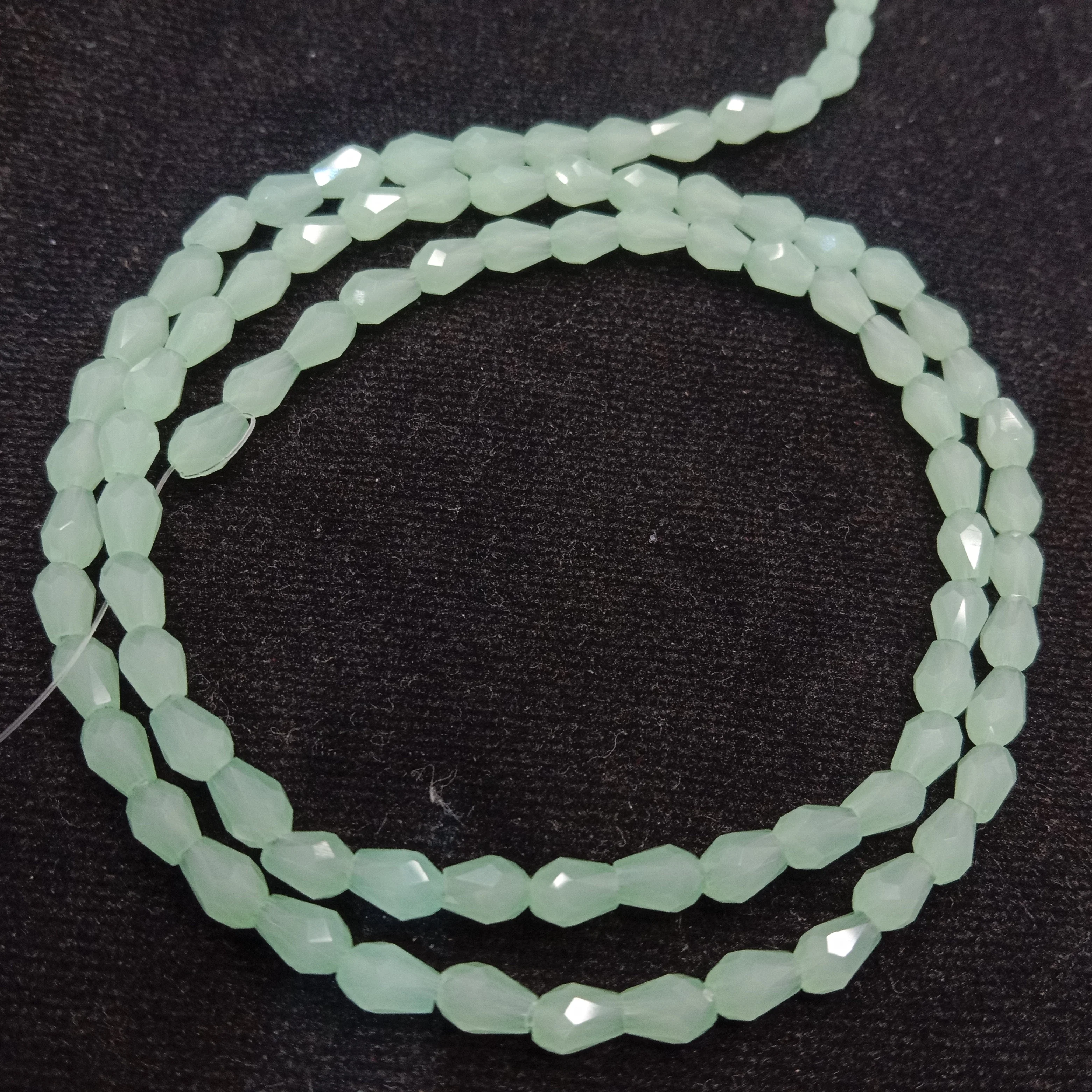 high quality light green small drop shape crystal beads 3x4mm 1 string
