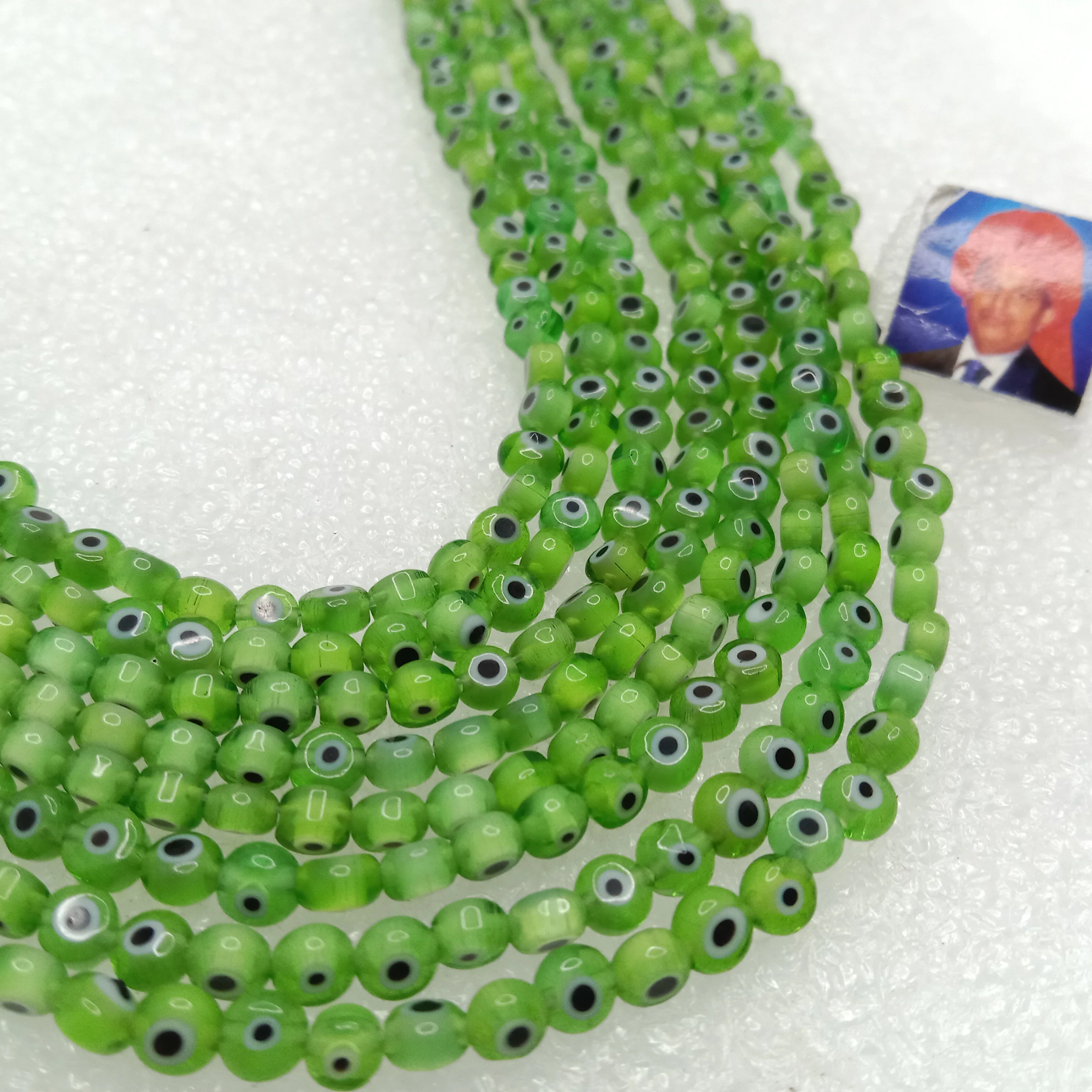 Light green  Evil eye flat shape beads 4mm 1 string