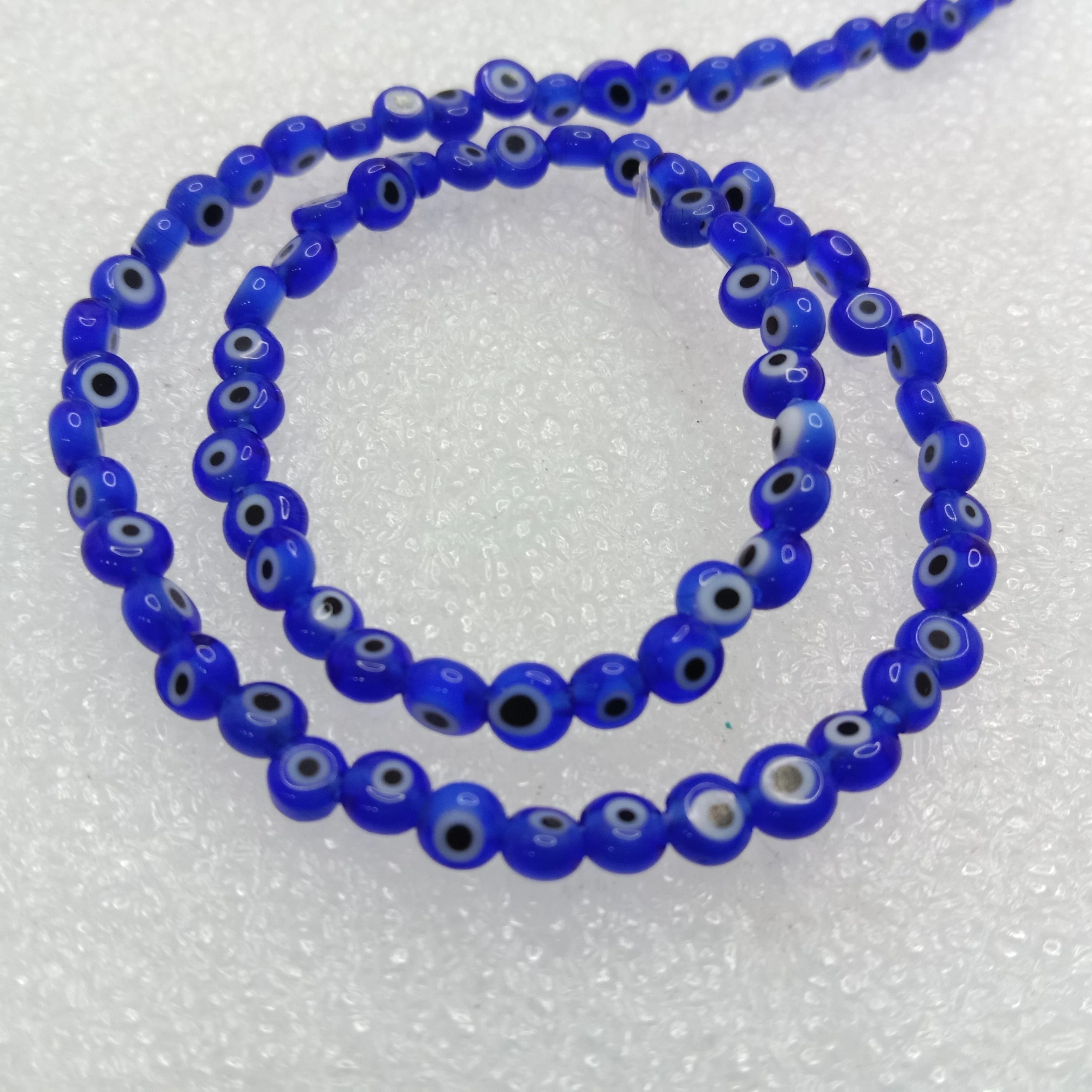 Dark blue Evil eye flat shape beads 4mm 1 string