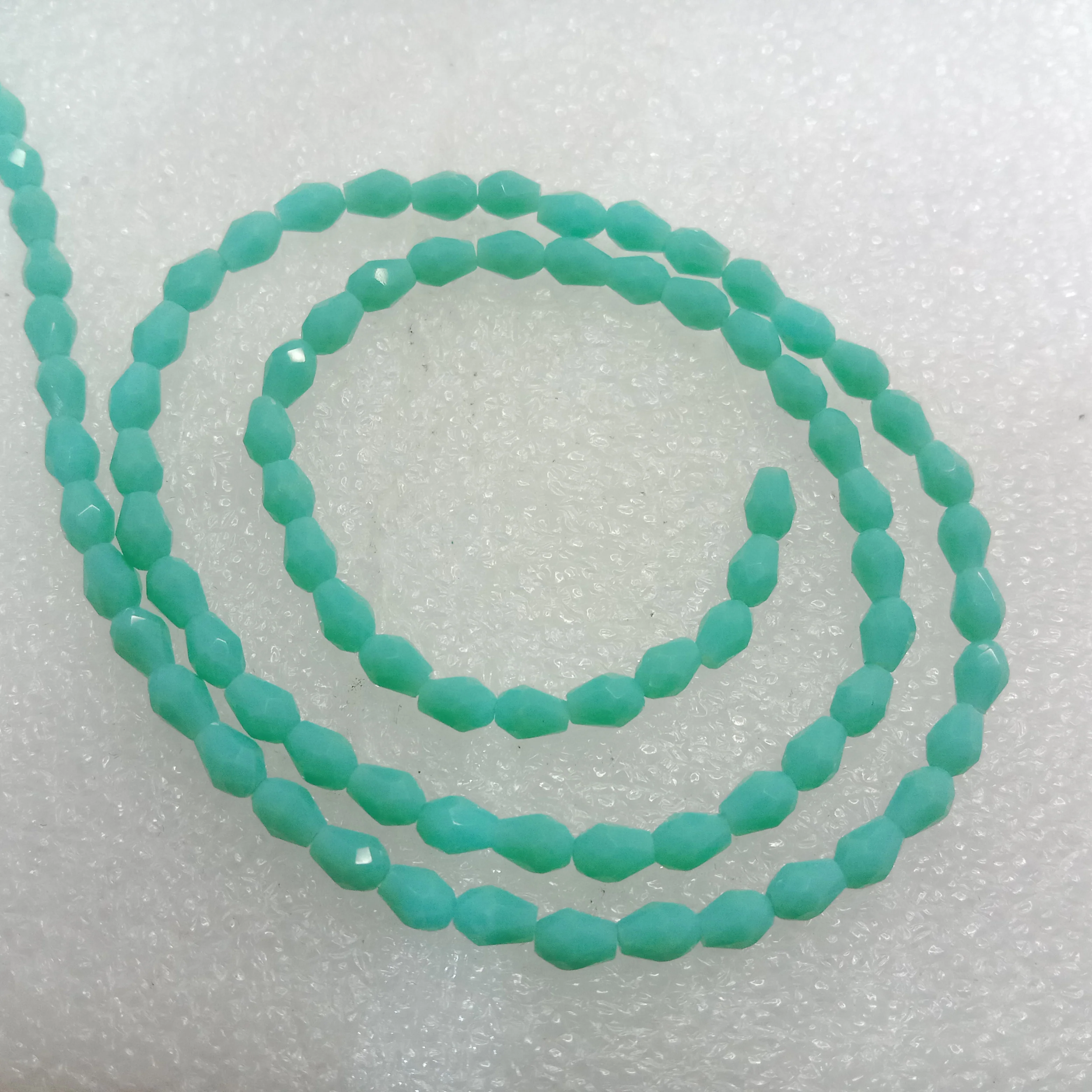 high quality sea green small drop shape crystal beads 3x4mm 1 string