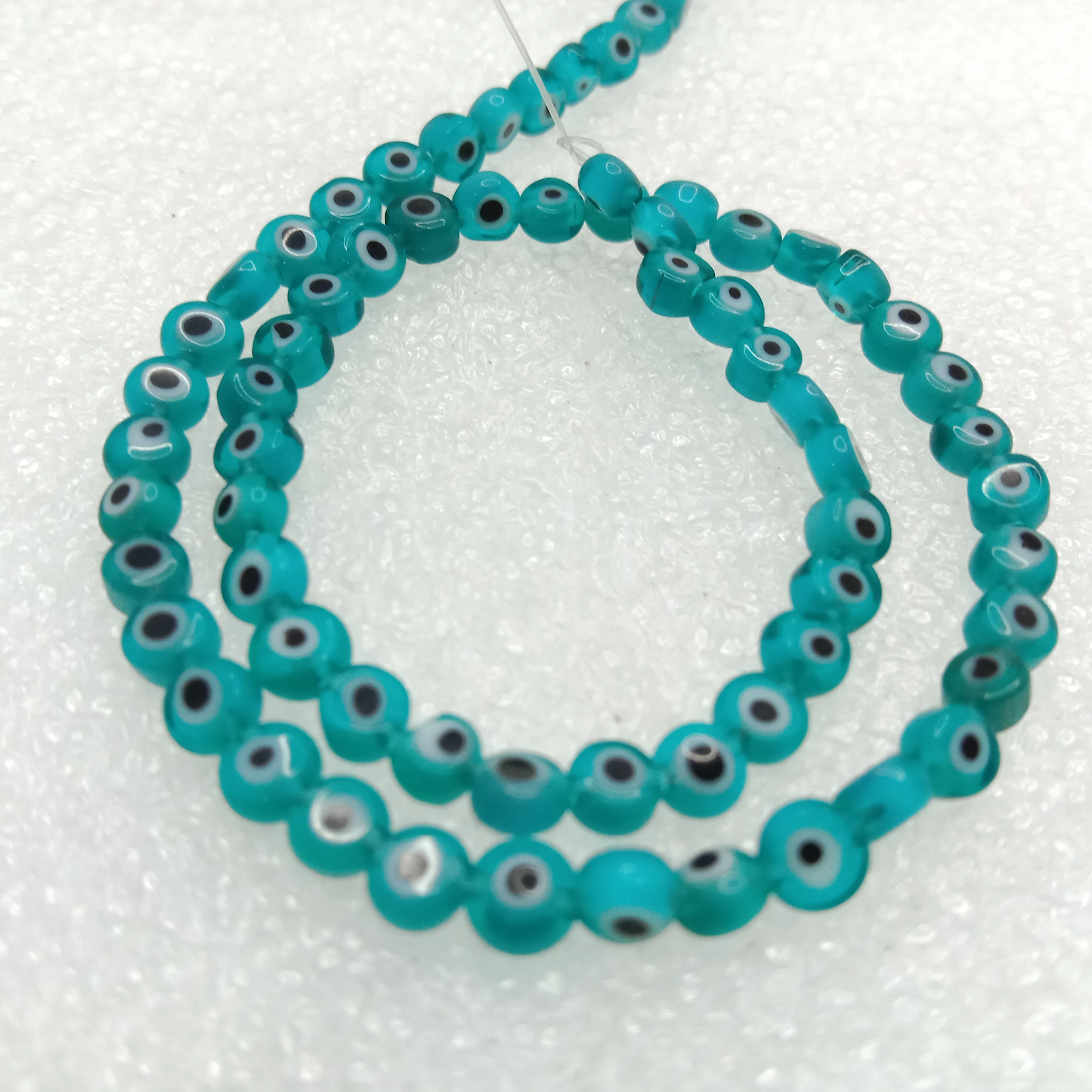 Sea green Evil eye flat  shape beads 4mm 1 string