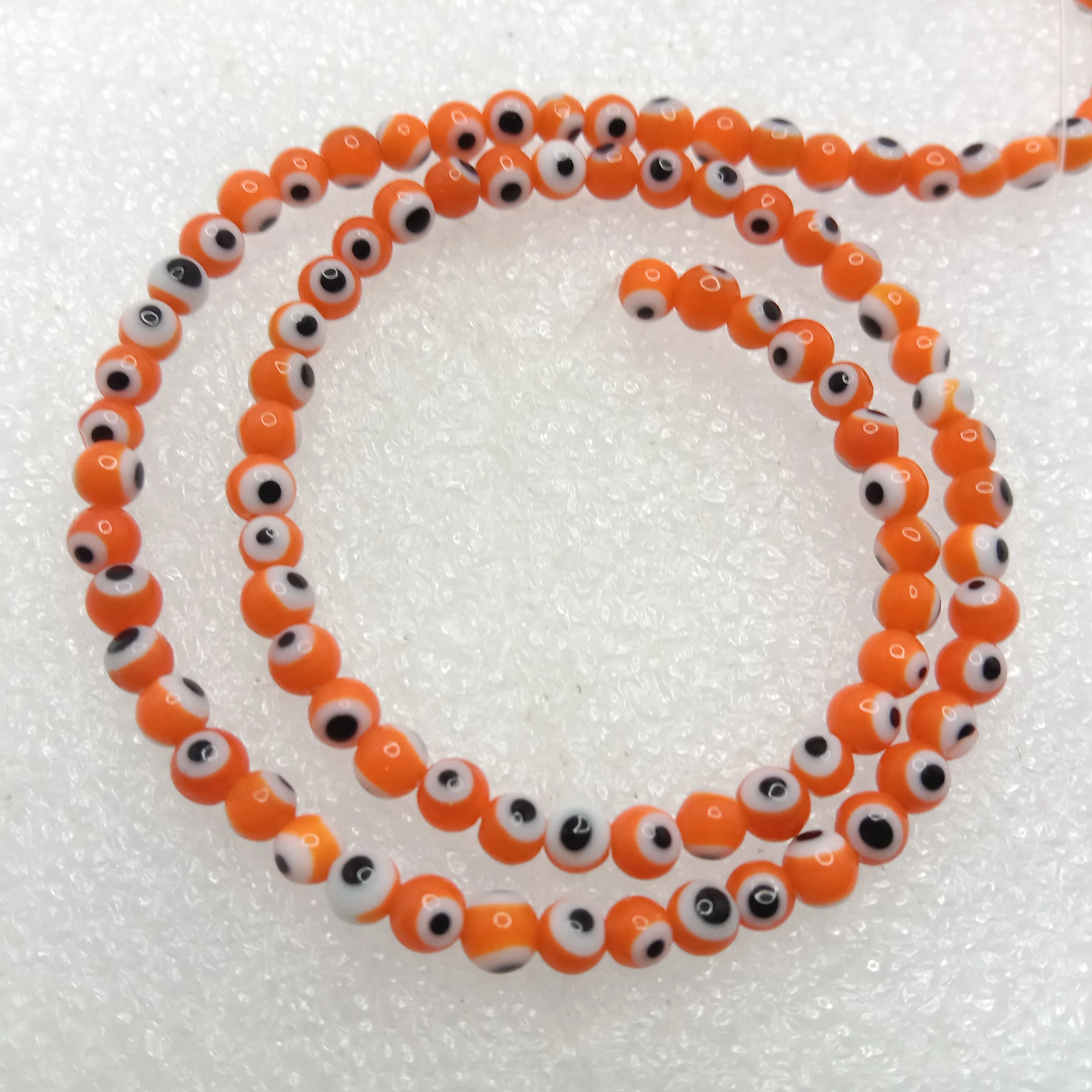 Orange Evil eye round shape beads 4mm 1 string