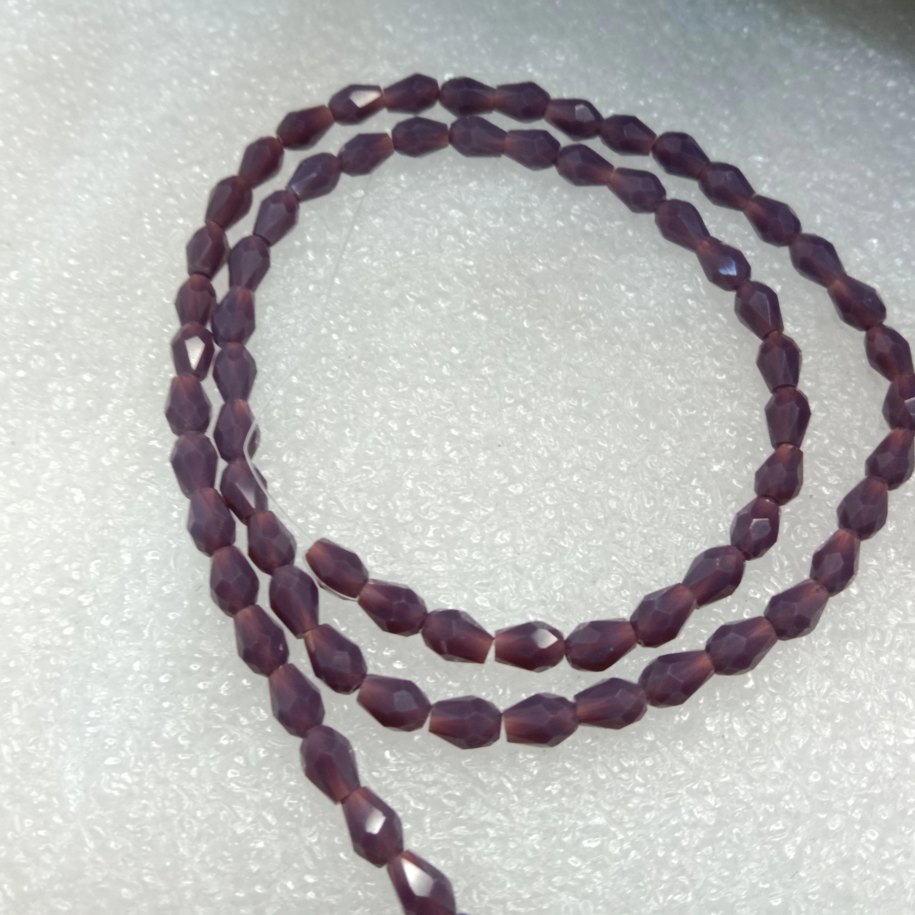 high quality dark purple small drop shape crystal beads 3x4mm 1 string