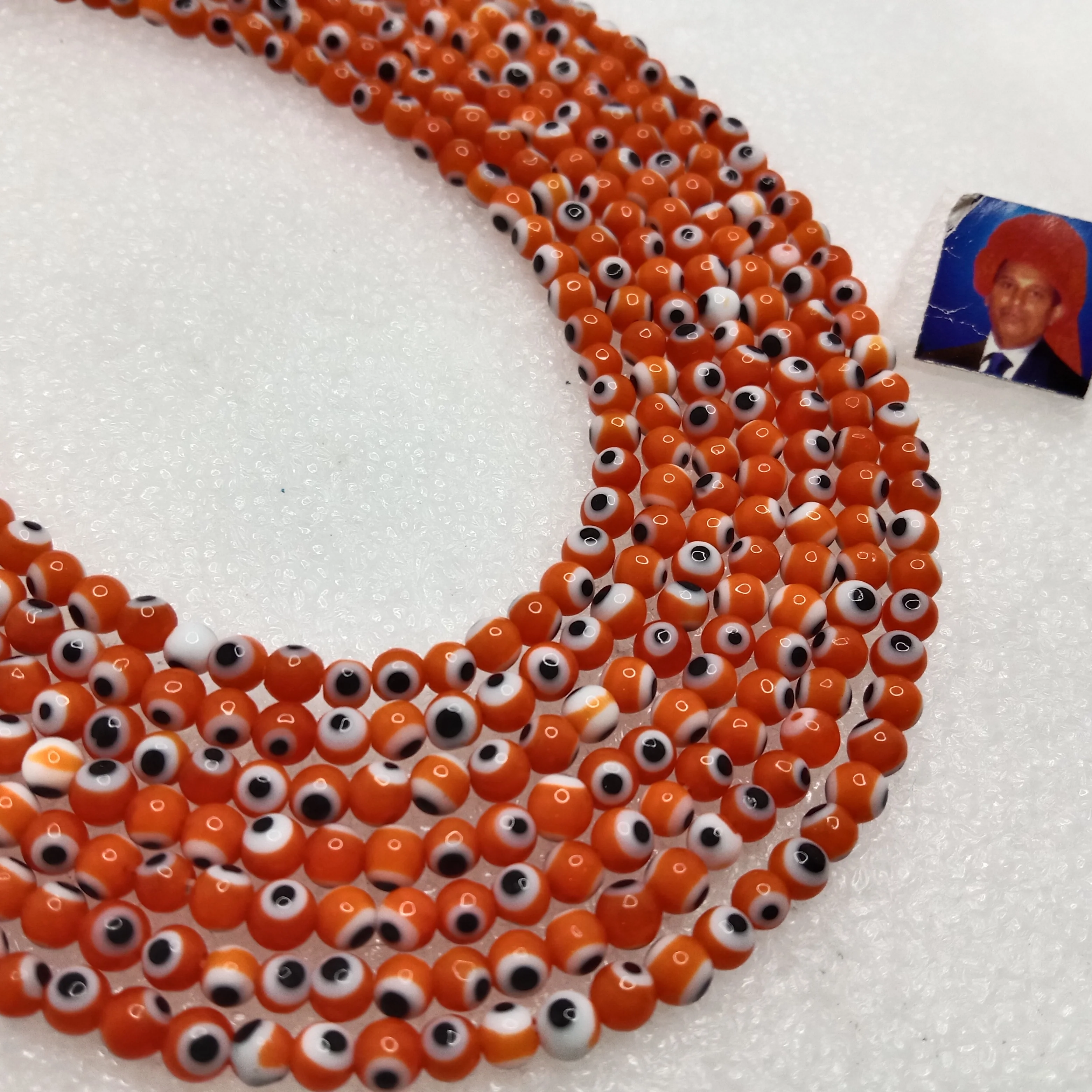 Orange Evil eye round shape beads 4mm 1 string