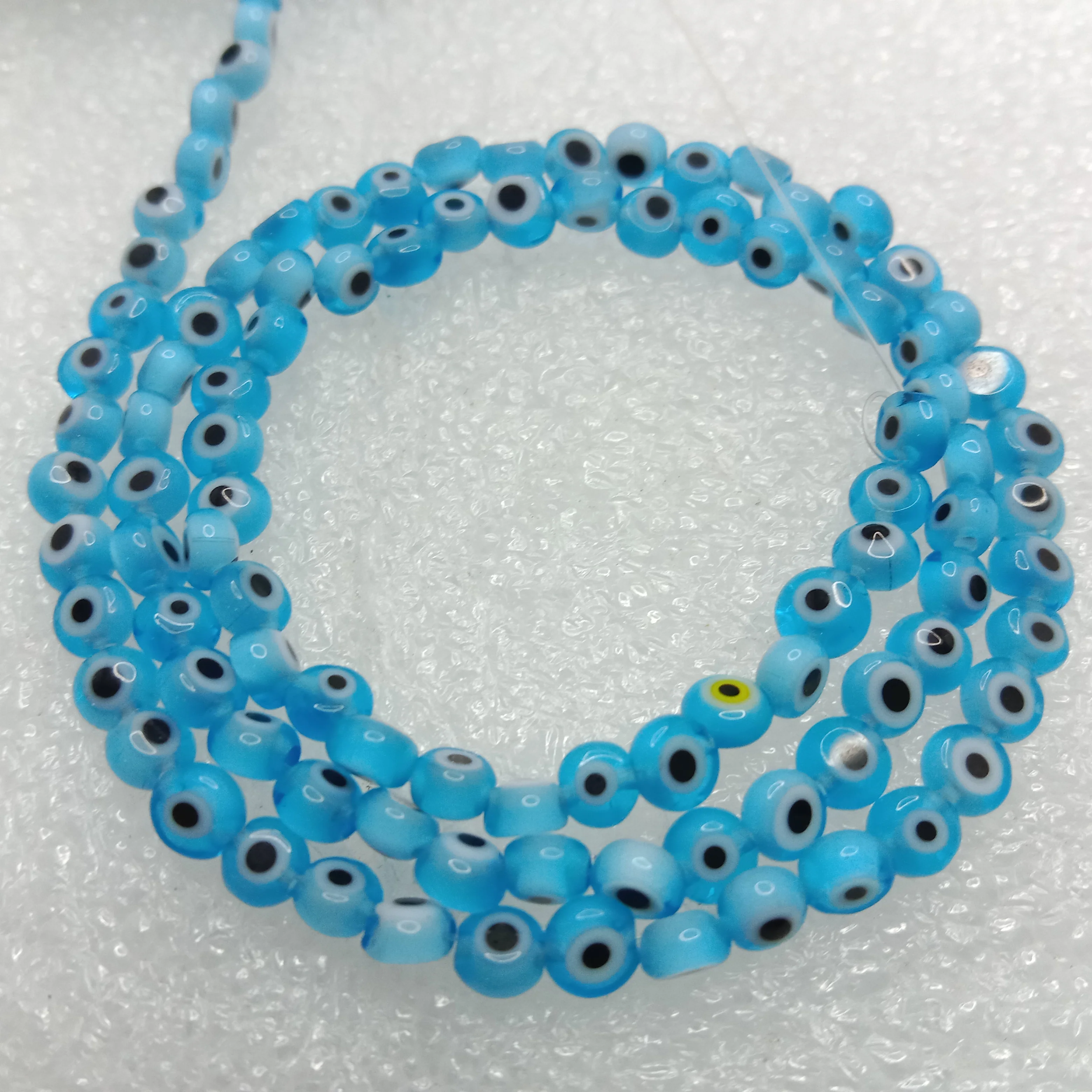 Light blue  Evil eye flat shape beads 4mm 1 string