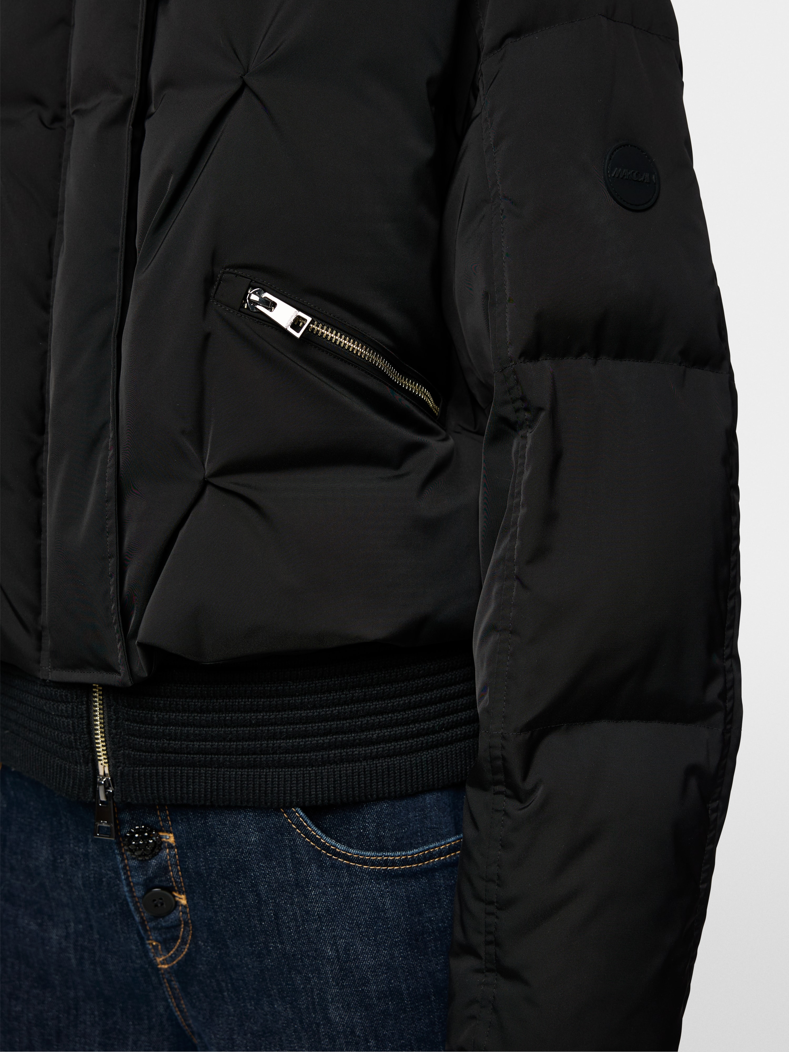 Marc Cain Quilted down jacket with knitted cuffs