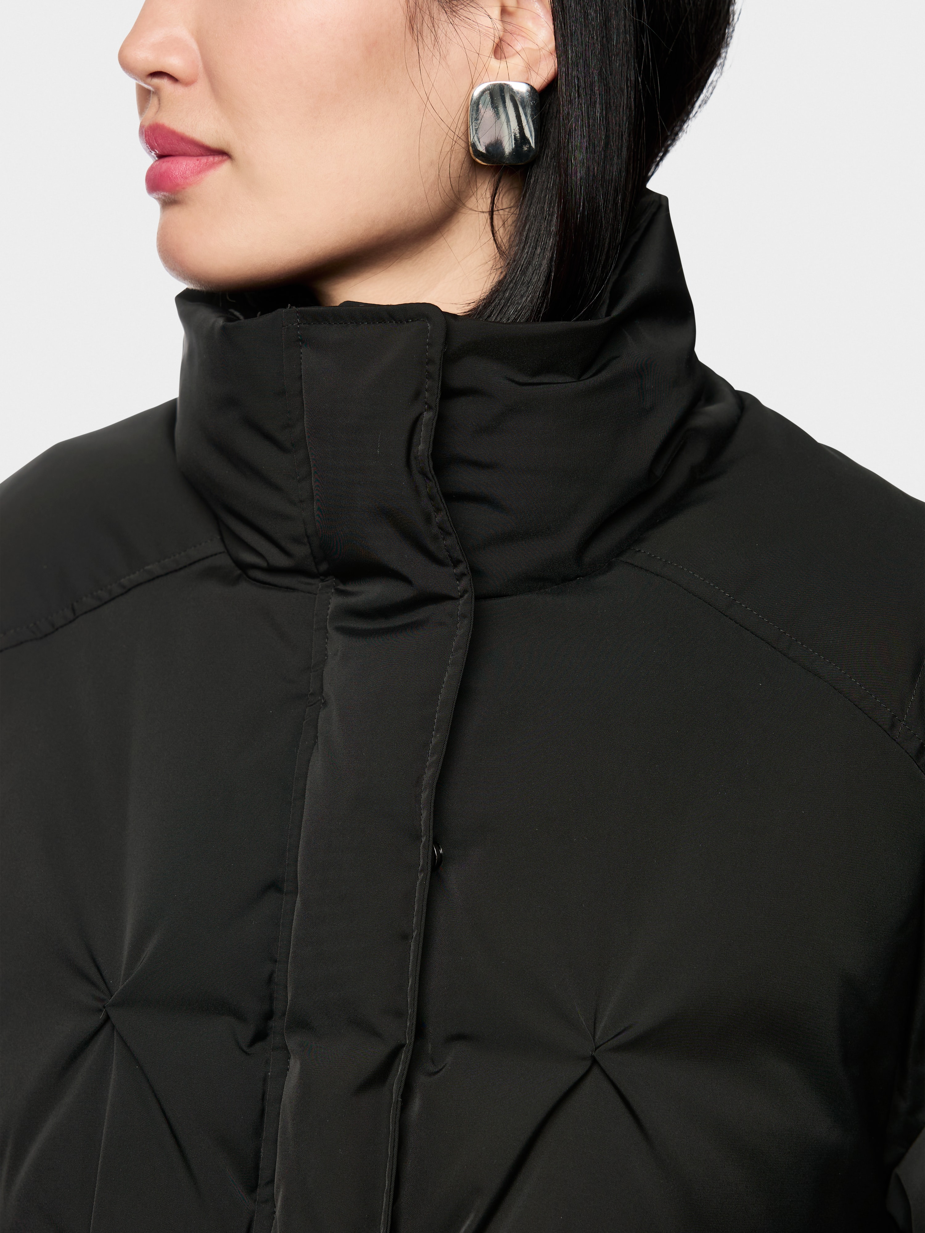 Marc Cain Quilted down jacket with knitted cuffs
